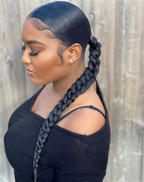 Interesting Updo. . Two braids into a ponytail black hair